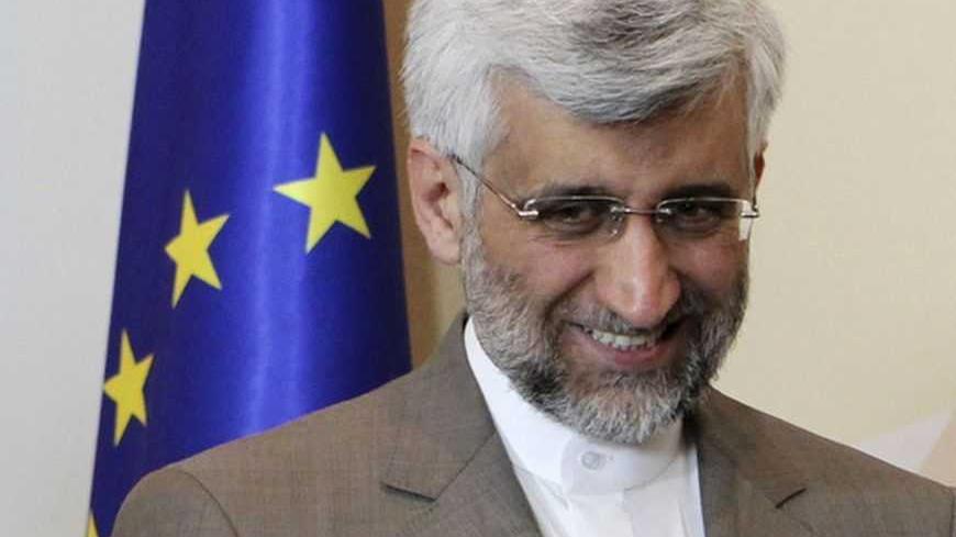 Iran's Supreme National Security Council Secretary and chief nuclear negotiator Saeed Jalili smiles before talks in Almaty February 26, 2013. World powers began talks with Iran on its nuclear programme in the Kazakh city of Almaty on Tuesday, in a fresh attempt to resolve a decade-old standoff that threatens the Middle East with a new war. REUTERS/Stanislav Filippov/Pool  (KAZAKHSTAN - Tags: POLITICS ENERGY) - RTR3EATB