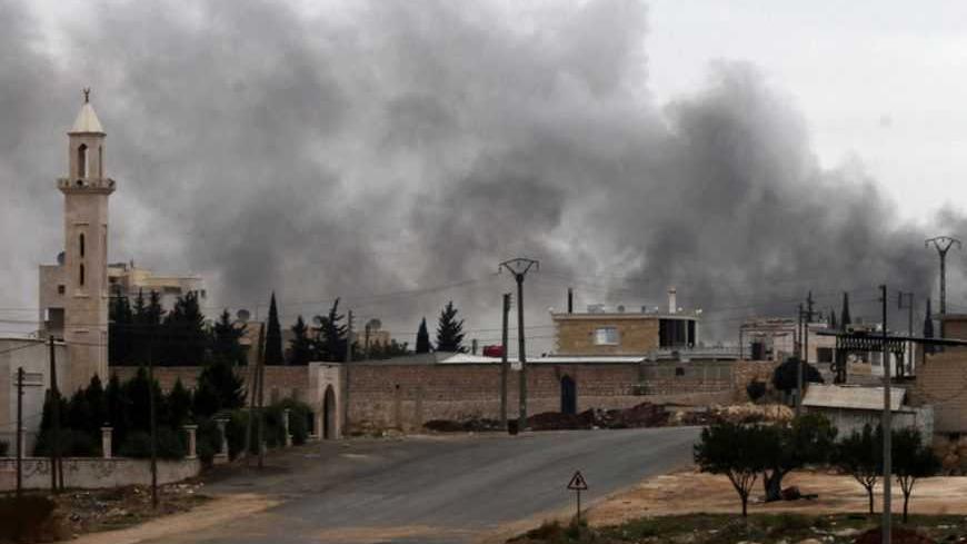 Smoke rises from burnt factories after being shelled at Khan al-Assal November 10, 2012. Picture taken November 10, 2012. REUTERS/Zain Karam  (SYRIA - Tags: CONFLICT) - RTR3A97R