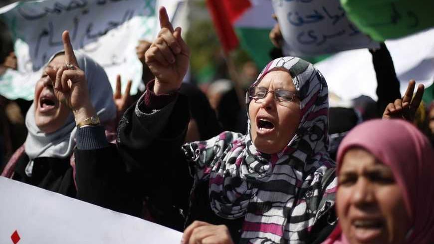 Palestinian women take part in a protest against the death of a Palestinian detainee in an Israeli jail, in Gaza City February 24, 2013. Palestinian officials on Saturday demanded an international investigation into the death of a Palestinian detainee who died in an Israeli jail hours earlier. A spokeswoman for Israel's Prison Authority said that the detainee, 30-year-old Arafat Jaradat, had apparently died of cardiac arrest. An emergency service team had tried to resuscitate him but failed, she said. REUTE