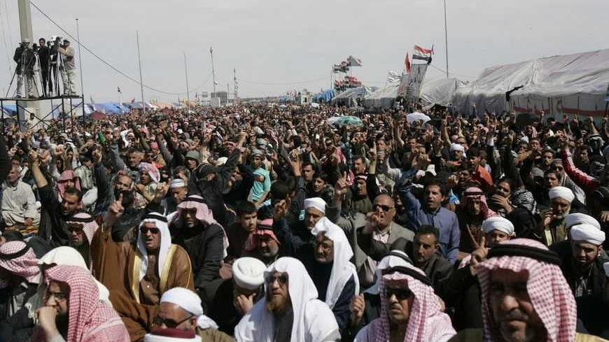 Sunni Muslims chant "Allahu Akbar", meaning God is great, during an anti-government demonstration in Ramadi, 100 km (62 miles) west of Baghdad, March 8, 2013.Thousands of Sunni Muslims protested after Friday prayers in huge rallies against Shi'ite Iraqi Prime Minister Nuri al-Maliki, demanding that he step down. REUTERS/Ali al-Mashhadani (IRAQ - Tags: CIVIL UNREST POLITICS RELIGION) - RTR3EQ8A