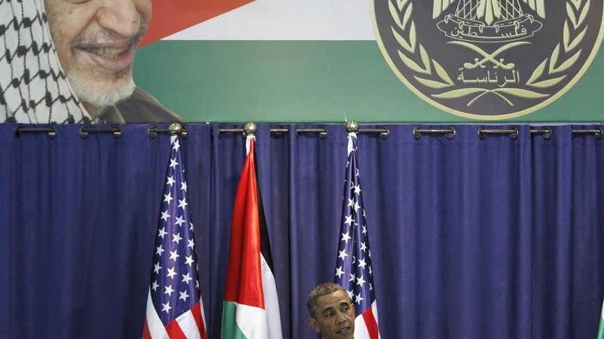 U.S. President Barack Obama speaks during a joint news conference with Palestinian President Mahmoud Abbas (not pictured) at the Muqata presidential compound in the West Bank city of Ramallah March 21, 2013. Obama said on Thursday that settlement building in the occupied West Bank did not "advance the cause of peace", but stopped short of demanding a construction freeze to enable negotiations to resume. REUTERS/Ammar Awad (WEST BANK - Tags: POLITICS) - RTR3F9Q2