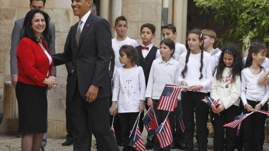 U.S. President Barack Obama is seen next to Bethlehem Mayor Vera Baboun (L) and children at the Church of the Nativity in Bethlehem March 22, 2013.   REUTERS/Jason Reed   (WEST BANK - Tags: POLITICS RELIGION) - RTR3FBRR