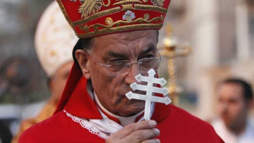 Lebanon's Maronite Patriarch Beshara Rai attends a memorial ceremony for victims killed in a militant attack on the Our Lady of Salvation Church in 2010, at the Church in Baghdad October 31, 2011. Fifty-two hostages and police were killed during an attack on the church on October 31, 2010. REUTERS/Saad Shalash (IRAQ - Tags: POLITICS SOCIETY RELIGION CRIME LAW ANNIVERSARY) - RTR2TGJO