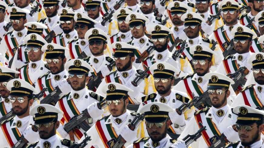 EDITORS' NOTE: Reuters and other foreign media are subject to Iranian restrictions on their ability to report, film or take pictures in Tehran. 

Members of the Iranian Revolutionary Guard Navy march during a parade to commemorate the anniversary of the Iran-Iraq war (1980-88), in Tehran September 22, 2011. REUTERS/Stringer (IRAN - Tags: POLITICS MILITARY ANNIVERSARY) - RTR2RNS7