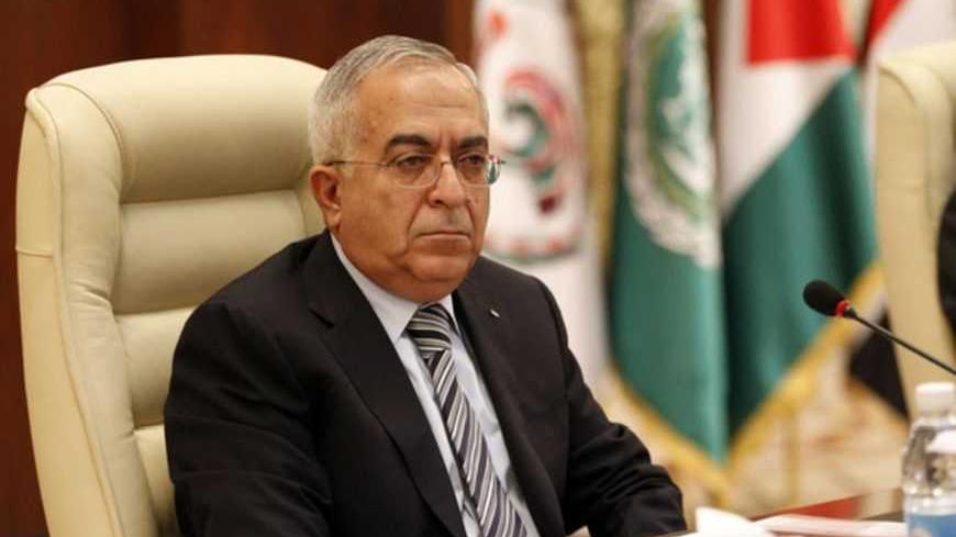 Palestinian Prime Minister Salam Fayyad attends the opening session of an international conference of solidarity with the Palestinian and Arab prisoners and detainees in Israel's prisons, in Baghdad December 11, 2012. REUTERS/Thaier Al-Sudani (IRAQ - Tags: POLITICS) - RTR3BFVA