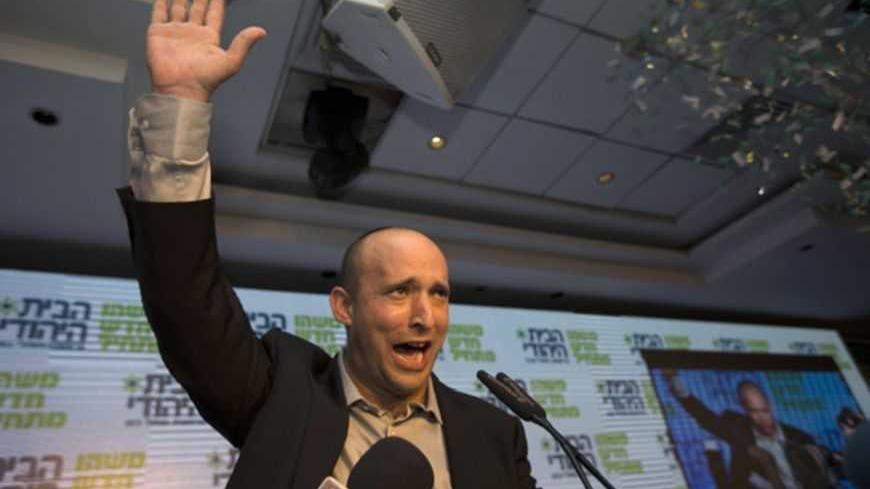 Head of the Bayit Yehudi party Naftali Bennett waves to supporters at his party's headquarters in Ramat Gan, near Tel Aviv January 22, 2013. Hawkish Prime Minister Benjamin Netanyahu emerged the bruised winner of Israel's election on Tuesday, claiming victory despite unexpected losses to resurgent centre-left challengers. Netanyahu has traditionally looked to religious, conservative parties for backing and is widely expected to seek out self-made millionaire Bennett, who heads the Jewish Home party and stol