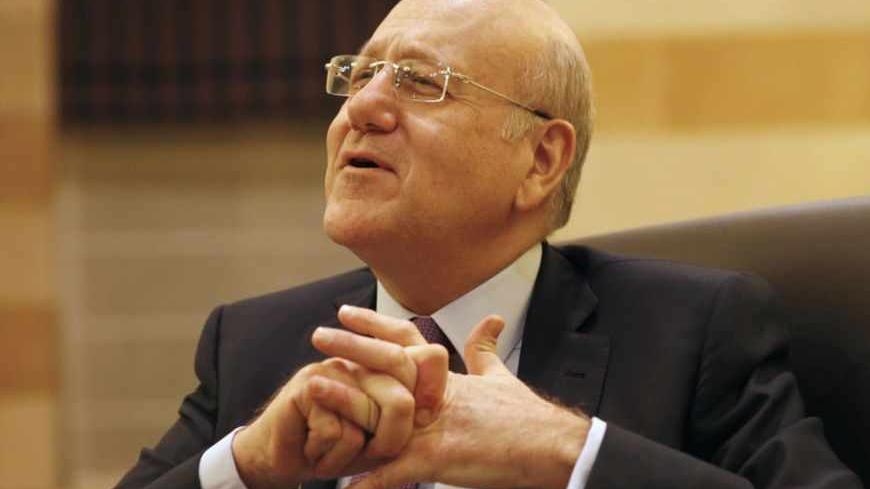 Lebanon's Prime Minister Najib Mikati talks during an interview with Reuters at the Grand Serail, the government headquarters in Beirut March 12, 2013. Mikati urged Arab states to help Lebanon cope with a flood of Syrian refugees who are stretching its scarce resources and will need at least $370 million in support this year. Picture taken March 12, 2013. To match Interview SYRIA-CRISIS/LEBANON REUTERS/Jamal Saidi (LEBANON - Tags: POLITICS PROFILE) - RTR3EXH0