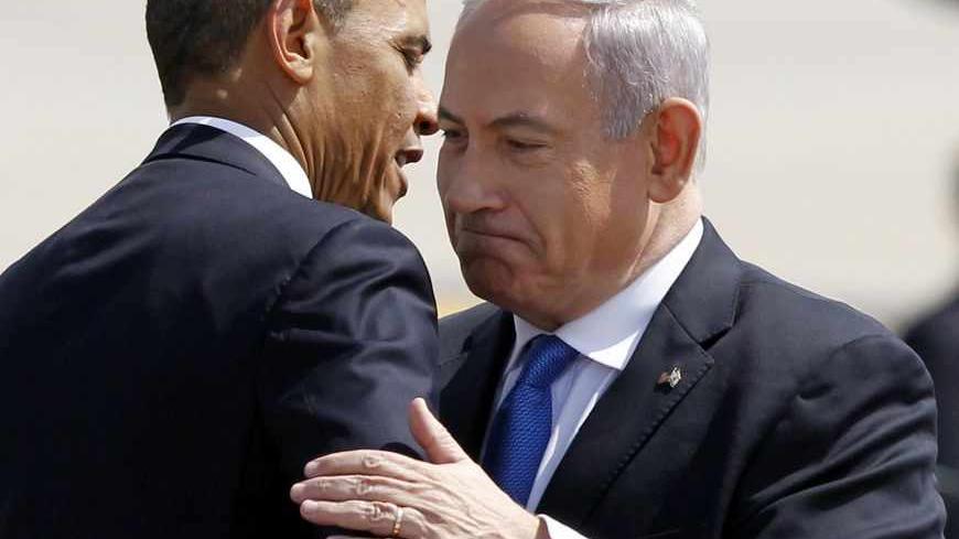 U.S. President Barack Obama hugs Israeli Prime Minister Benjamin Netanyahu at Ben Gurion International Airport Airport in Tel Aviv March 20, 2013. Obama said at the start of his first official visit to Israel on Wednesday that the U.S. commitment to the security of the Jewish state was rock solid and that peace must come to the Holy Land.  REUTERS/Jason Reed (ISRAEL - Tags: POLITICS) - RTR3F8UU