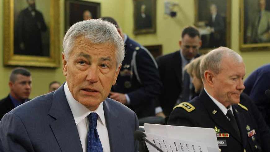 U.S. Secretary of Defense Chuck Hagel (L) and the Chairman of the Joint Chiefs of Staff Army General Martin Dempsey (R) testify before the House Appropriations Defense Subcommittee in Washington April 16, 2013.    REUTERS/Gary Cameron  (UNITED STATES - Tags: POLITICS MILITARY) - RTXYNPQ