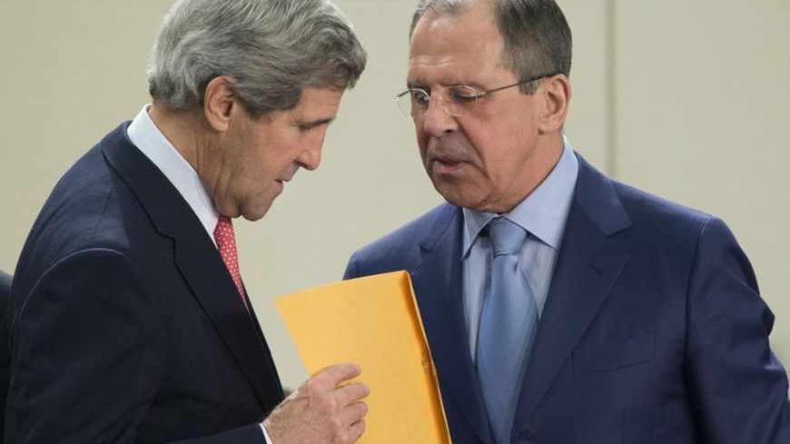 Russian Foreign Minister Sergei Lavrov (R) hands an envelope to U.S. Secretary of State John Kerry before the start of the NATO- Russia Council meeting at NATO headquarters in Brussels April 23, 2013. REUTERS/Evan Vucci/Pool (BELGIRUM - Tags: POLITICS) - RTXYWSB
