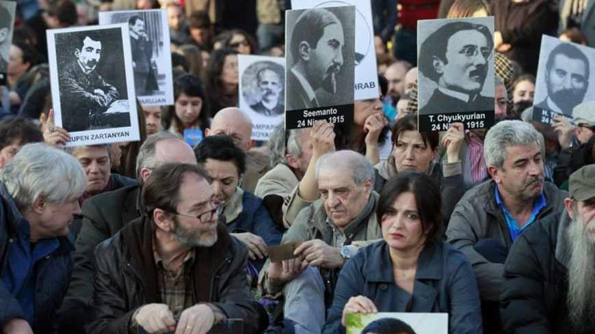 Human rights activists hold pictures of Armenian victims at Taksim square in central Istanbul April 24, 2013, during a demonstration to commemorate the 1915 mass killing of Armenians in the Ottoman Empire. REUTERS/Osman Orsal (TURKEY - Tags: ANNIVERSARY POLITICS CIVIL UNREST) - RTXYYDA