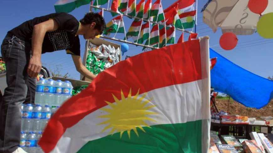 An Iraqi Kurdish street vendor sells Kurdish flags in Arbil, about 300 kilometres, northeast of Baghdad, as people commemorate those who were killed in the 1988 Anfal massacre on March 15, 2013. An estimated 182,000 people died in the brutal "Anfal" (Spoils of War) campaign carried out by Saddam Hussein's forces 25 years ago. AFP PHOTO/ ALI AL-SAADI        (Photo credit should read ALI AL-SAADI/AFP/Getty Images)