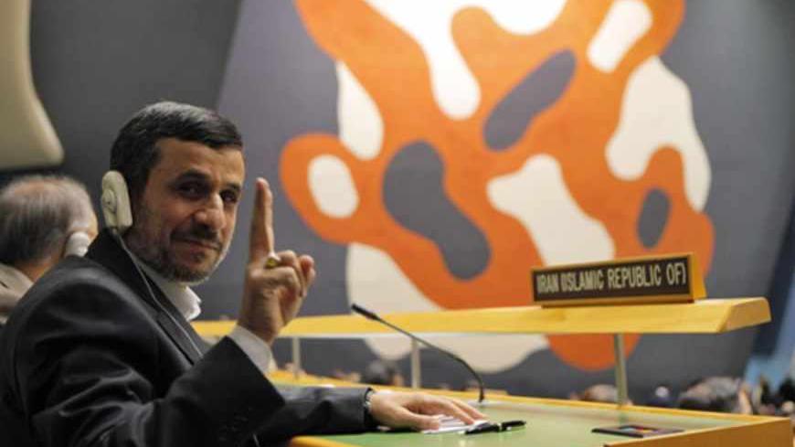 Iran's President Mahmoud Ahmadinejad flashes a V-sign during the high-level meeting of the General Assembly on the Rule of Law at the United Nations headquarters in New York September 24, 2012. REUTERS/Eduardo Munoz (UNITED STATES - Tags: POLITICS) - RTR38CV7