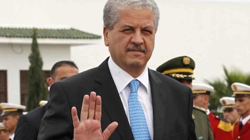 Algeria's Prime Minister Abdelmalek Sellal waves during a welcoming ceremony with Italy's Prime Minister Mario Monti (not pictured) at Houari Boumediene Airport in Algiers November 14, 2012. Picture taken November 14, 2012.    REUTERS/Louafi Larbi    (ALGERIA  - Tags: POLITICS)   - RTR3DHZF