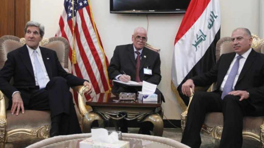 U.S. Secretary of State John Kerry (L) meets with Iraq's Parliament Speaker Osama al-Nujaifi (R) in Baghdad March 24, 2013. Kerry made an unannounced visit to Iraq on Sunday and will urge Prime Minister Nuri al-Maliki to make sure Iranian flights over Iraq do not carry arms and fighters to Syria, a U.S. official said.     REUTERS/Jason Reed     (IRAQ - Tags: POLITICS) - RTXXVNF