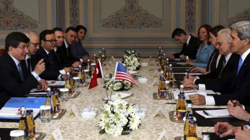 U.S. Secretary of State John Kerry (2nd R) meets with Turkey's Foreign Minister Ahmet Davutoglu (L) at Ciragan Palace in Istanbul April 7, 2013. Kerry said on Sunday it was not up to Washington to set a deadline for Turkey and Israel to normalise ties but stressed the importance of restoring a full relationship between the two. REUTERS/Hakan Goktepe/Pool (TURKEY - Tags: POLITICS) - RTXYBQO
