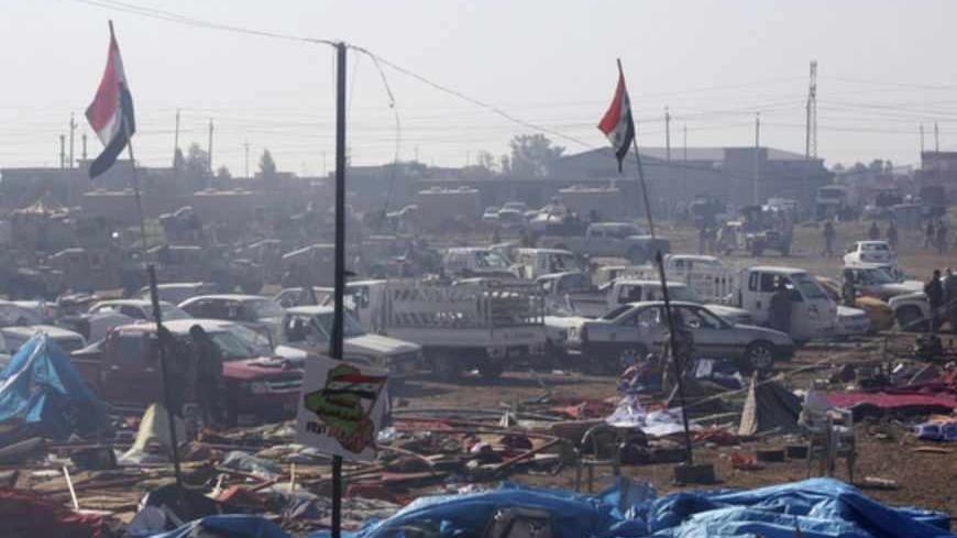 A view of a destroyed makeshift camp at a public square in Hawija, near Kirkuk, 170 km (100 miles) north of Baghdad April 23, 2013. Iraqi forces stormed the Sunni Muslim protest camp on Tuesday, and more than 50 people were killed in the ensuing clashes which spread beyond the town of Hawija, to other areas. Picture taken April 23, 2013.   REUTERS/Stringer (IRAQ - Tags: CIVIL UNREST MILITARY POLITICS) - RTXYZEU