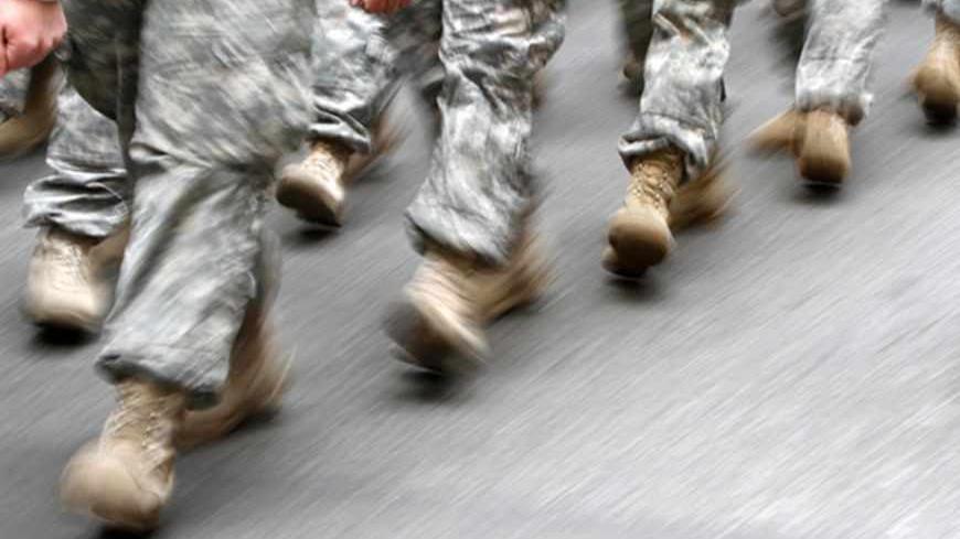 U.S. army soldiers are seen marching in the St. Patrick's Day Parade in New York, March 16, 2013.  REUTERS/Carlo Allegri  (UNITED STATES - Tags: SOCIETY) - RTR3F326