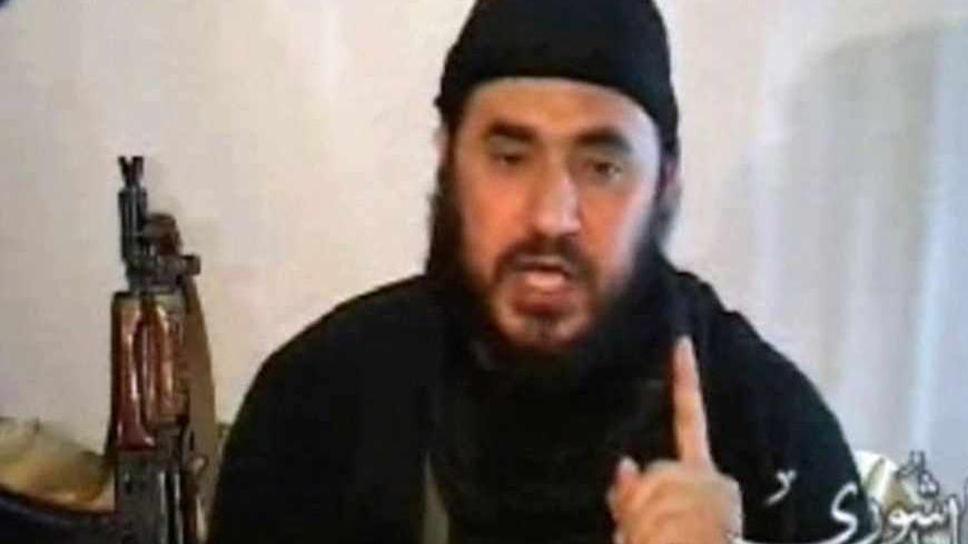 The leader of al Qaeda in Iraq, Abu Musab al-Zarqawi, speaks in a rare video of him posted on the Internet on April 25, 2006.  Zarqawi said Mujahideen were fighting on despite a three-year "crusader" war in Iraq.         REUTERS/handout - RTR1CSXF