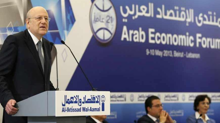 Lebanon's caretaker Prime Minister Najib Mikati speaks during the opening of the Arab Economic Forum 2013 at a hotel in Beirut May 9, 2013. REUTERS/Mohamed Azakir (LEBANON - Tags: BUSINESS POLITICS) - RTXZG0A