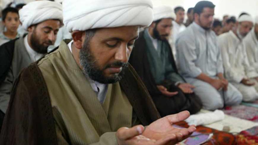 Iraqi Shi'ite al Hawza cleric Sheikh Jassim Al-Saidi prays in a Baghdad
mosque June 3, 2003 after being released from detention by U.S. forces.
Al-Saidi said that he had been accused of instigating violence towards
American forces occupying Iraq. REUTERS/Faleh Kheiber REUTERS

CLH/ - RTROS2A