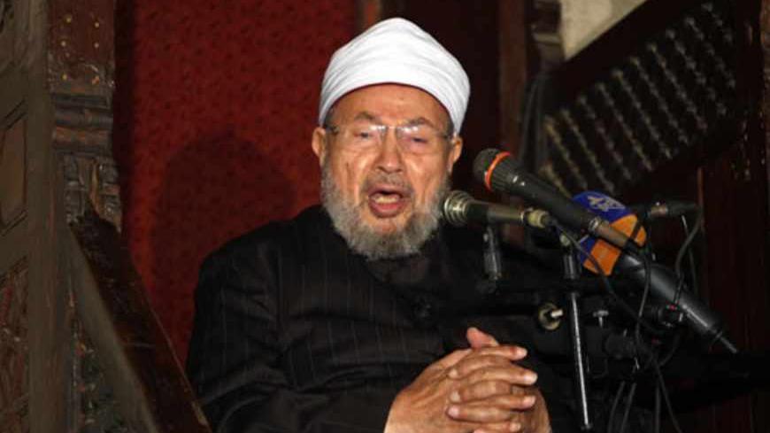 Egyptian Muslim scholar Sheikh Yusuf al-Qaradawi addresses Muslims at Al-Azhar mosque during the weekly Friday prayer in Cairo on December 28, 2012. People demonstrated outside the Al-Azhar mosque in support of the Syrian people and against Syria's President Bashar al-Assad.  AFP PHOTO/MAHMUD HAMS        (Photo credit should read MAHMUD HAMS/AFP/Getty Images)