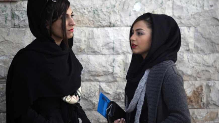 EDITORS' NOTE: Reuters and other foreign media are subject to Iranian restrictions on leaving the office to report, film or take pictures in Tehran.
Two Iranian women talk at a corner of a square in northern Tehran February 26, 2012. Picture taken on February 26, 2012. REUTERS/Morteza Nikoubazl (IRAN - Tags: SOCIETY) - RTR2YMKO