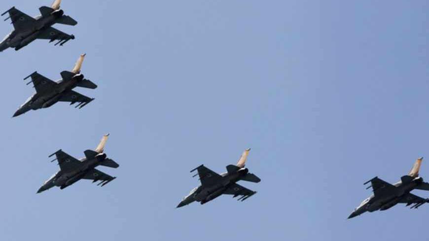 Israeli Air Force F-16 war planes fly in formation over the Mediterranean Sea as part of celebrations for Israel's Independence Day, marking the 65th anniversary of the creation of the state, April 16, 2013. REUTERS/Amir Cohen (ISRAEL - Tags: TRANSPORT MILITARY ANNIVERSARY) - RTXYO3U