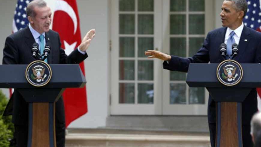 U.S. President Barack Obama (R) and Turkish Prime Minister Recep Tayyip Erdogan hold a joint news conference in the White House Rose Garden in Washington, May 16, 2013. REUTERS/Jason Reed (UNITED STATES  - Tags: POLITICS)   - RTXZPC4