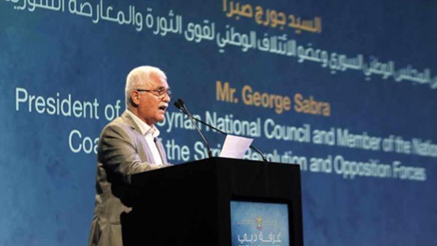 President of the Syrian National Council George Sabra speaks during a conference for the reconstruction of Syria, at Madinat Jumeirah in Dubai November 21, 2012. REUTERS/Jumana El Heloueh (UNITED ARAB EMIRATES - Tags: POLITICS) - RTR3AOOH