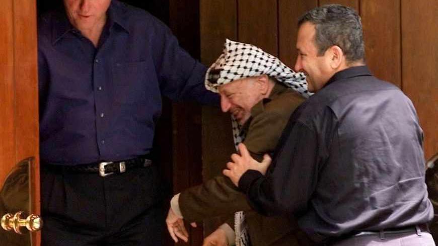 Israeli Prime Minister Ehud Barak (R) jokingly pushes Palestinian President Yasser Arafat (C) into the Laurel cabin on the grounds of Camp David as U.S. President Bill Clinton watches during peace talks, July 11. Arafat and Barak were insisting that the other proceed through the door first. Camp David is the venue where Egypt and Israel made peace in September 1978, and the Laurel cabin was the site of many of the meetings.

WM/RCS - RTRC2FV