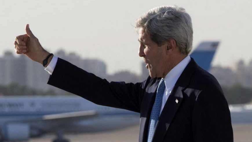 U.S. Secretary of State John Kerry gives a thumbs up as he departs Kuwait City, June 26, 2013, en route to Amman, Jordan. REUTERS/Jacquelyn Martin/Pool (KUWAIT - Tags: POLITICS) - RTX111TC