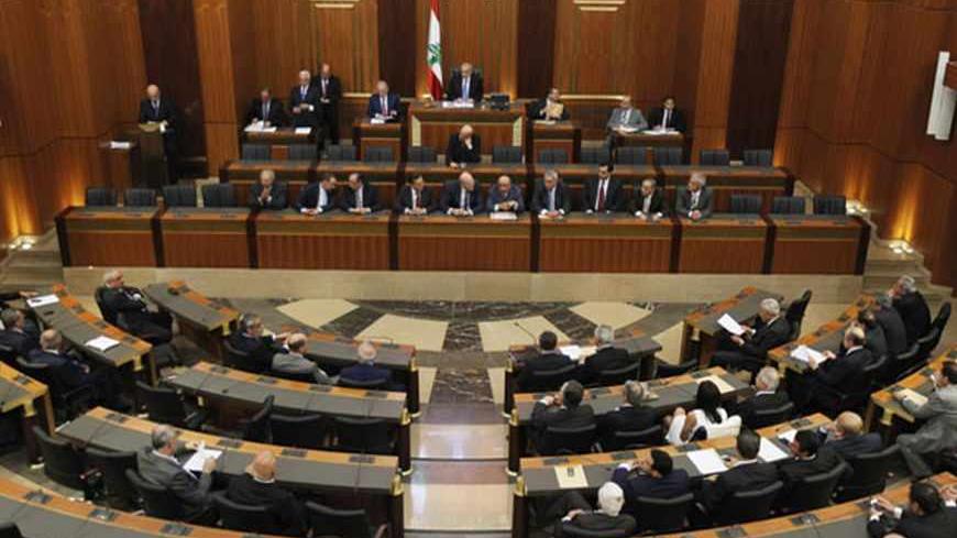 Lebanese members of parliament attend a session in Beirut, May 31, 2013. Lebanese lawmakers agreed on Friday to postpone a June parliamentary election until late next year due to instability in neighbouring Syria and political deadlock at home. REUTERS/Mohamed Azakir   (LEBANON - Tags: POLITICS ELECTIONS) - RTX1073U