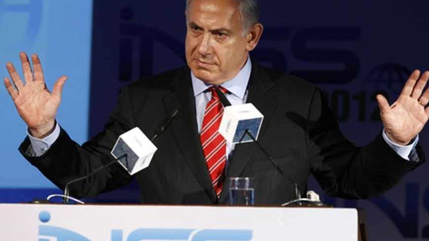 Israel's Prime Minister Benjamin Netanyahu gestures as he speaks at the annual Institute for National Security Studies (INSS) conference in Tel Aviv May 29, 2012. REUTERS/Amir Cohen (ISRAEL - Tags: POLITICS) - RTR32SUA