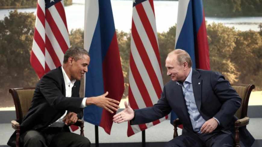 U.S. President Barack Obama and Russian President Vladimir Putin shake hands during their meeting at the G8 Summit at Lough Erne in Enniskillen, Northern Ireland June 17, 2013.   REUTERS/Kevin Lamarque   (NORTHERN IRELAND - Tags: POLITICS) - RTX10R95