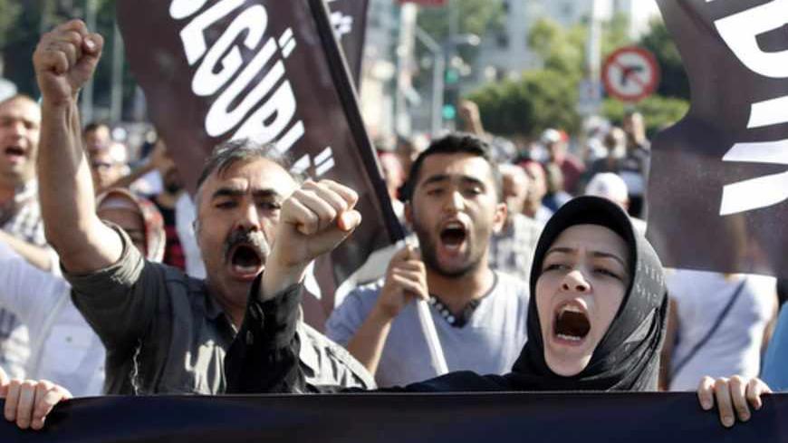 Anti-government protesters, who call themselves ''anti-capitalist Muslims'', shout slogans during a demonstration in Istanbul June 23, 2013. The European Union is on the verge of scrapping a new round of membership talks with Turkey, a move that would further undermine Ankara's already slim hopes of joining the bloc and damage its relations with Brussels. Germany, the EU's biggest economic power, is blocking efforts to revive Turkey's EU membership bid, partly because of its handling of anti-government prot