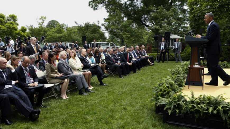 U.S. President Barack Obama (R) and Turkish Prime Minister Recep Tayyip Erdogan hold a joint news conference in the White House Rose Garden in Washington, May 16, 2013.  REUTERS/Kevin Lamarque (UNITED STATES  - Tags: POLITICS)   - RTXZPGI