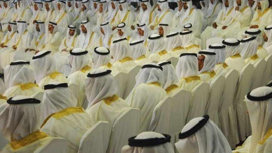 Grooms take part in a mass wedding ceremony in Tabuk, 1500 km (932 miles) from Riyadh, May 2, 2012. Governor of Tabuk Prince Fahad Bin Sultan bin Abdul-Aziz and a local group organised the mass wedding for about 1600 couples to help youths who are unable to afford expensive ceremonies because of the rising cost of living. REUTERS/Mohamed Alhwaity   (SAUDI ARABIA - Tags: SOCIETY) - RTR31J6Q