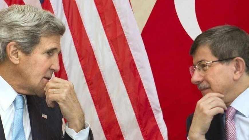 U.S. Secretary of State John Kerry (L) meets with Turkey's Foreign Minister Ahmet Davutoglu before attending the Association of Southeast Asian Nations (ASEAN) security meetings in Bandar Seri Begawan July 2, 2013. REUTERS/Jacquelyn Martin/Pool (BRUNEI - Tags: POLITICS) - RTX119IY
