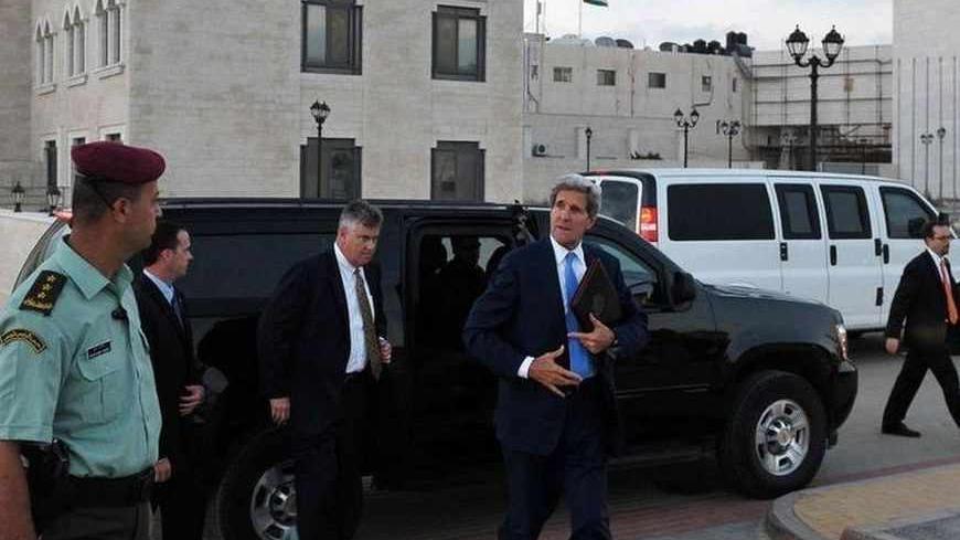 U.S. Secretary of State John Kerry steps out of an SUV as he prepares to depart from the Mukataa following a meeting with Palestinian President Mahmoud Abbas, in the West Bank city of Ramallah July 19, 2013. REUTERS/ Mandel Ngan/Pool (WEST BANK - Tags: POLITICS) - RTX11S5Q