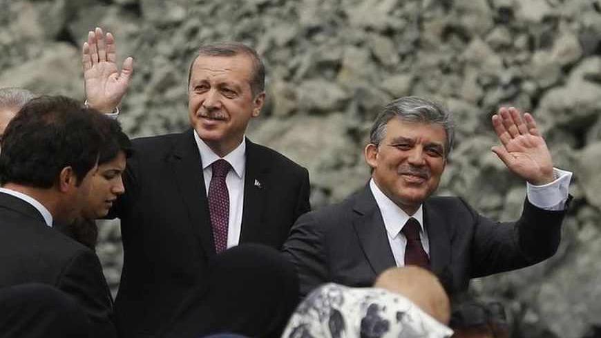 Turkey's Prime Minister Tayyip Erdogan and President Abdullah Gul (R) wave as they arrive at a groundbreaking ceremony for the third Bosphorus bridge linking the European and Asian sides of Istanbul May 29, 2013. REUTERS/Murad Sezer (TURKEY - Tags: BUSINESS CONSTRUCTION POLITICS) - RTX1050K