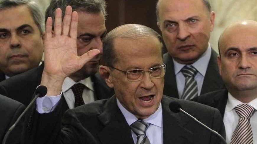 Lebanese oppositon Christian leader and head of the Free Patriotic Movement Michel Aoun (C), accompanied with his parliamentary bloc, speaks during a news conference, after meeting Lebanon's President Michel Suleiman at the presidential palace in Baabda, near Beirut, during the start of the two-day parliamentary consultations to choose a new prime minister, January 24, 2011.  Lebanese caretaker Prime Minister Saad al-Hariri said Monday he will not take part in a government lead by Hezbollah and its allies. 