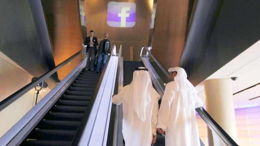 The Facebook logo is seen in front of an escalator at the venue of a news conference announcing the opening of Facebook offices in Dubai May 30, 2012. Social networking site Facebook opens its first office in the Middle East on Wednesday, in Dubai's Internet City, according to local media.  REUTERS/Jumana El Heloueh (UNITED ARAB EMIRATES - Tags: SOCIETY BUSINESS) - RTR32TVE