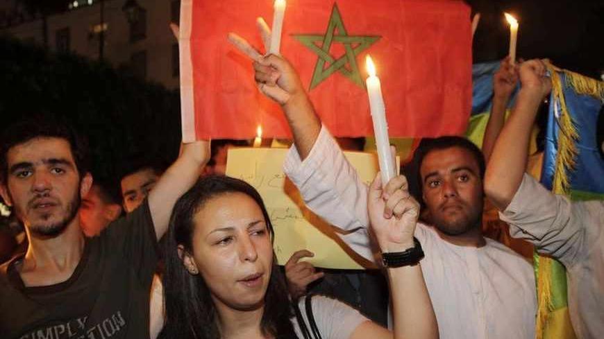 Protesters chant slogans during a sit-in against an initial royal pardon for a Spanish paedophile in Rabat, late August 7, 2013. Spanish police have arrested convicted paedophile Daniel Galvan Vina, who was serving a 30-year sentence in Morocco but was among 48 jailed Spaniards pardoned by Morocco's King Mohamed VI last week in what Spain said was a mix-up. The pardon was revoked by the king on Sunday following a protest in front of parliament on Friday over the decision to release Galvan, who had raped and