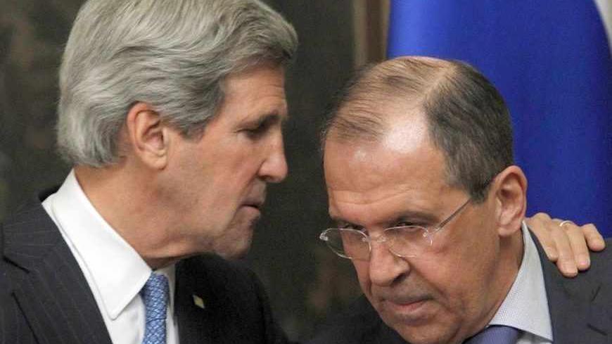 Russia's Foreign Minister Sergei Lavrov (R) and U.S. Secretary of State John Kerry speak during a joint news conference after their meeting in Moscow, May 7, 2013. The U.S. secretary of state sought Russian help in ending Syria's civil war on Tuesday, telling President Vladimir Putin in Moscow that common interest in a stable Middle East could bridge divisions among the big powers. REUTERS/Sergei Karpukhin (RUSSIA - Tags: POLITICS CONFLICT TPX IMAGES OF THE DAY) - RTXZE2I