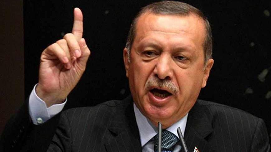 Turkey's Prime Minister Recep Tayyip Erdogan gestures as he gives a speech during a meeting at his ruling Justice and Development Party (AKP) party headquarters in Ankara, on August 20, 2013. Turkish Prime Minister Recep Tayyip Erdogan accused Israel on August 20 of being behind the military-backed ouster of Egypt's Islamist president Mohamed Morsi last month.  AFP PHOTO / ADEM ALTAN        (Photo credit should read ADEM ALTAN/AFP/Getty Images)