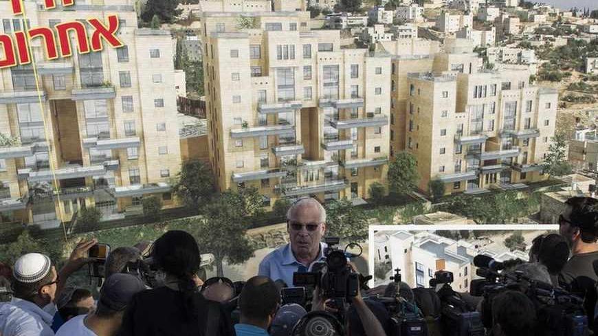 Israeli Housing Minister Uri Ariel speaks to reporters at a ceremony announcing the resumption of construction of an Israeli neighbourhood in East Jerusalem August 11, 2013. Israel moved forward on Sunday with plans to build nearly 1,200 new homes for Jewish settlers holding fast to a defiant settlement policy just days before its expected release of Palestinian prisoners.       REUTERS/Ronen Zvulun (JERUSALEM - Tags: POLITICS) - RTX12HFR