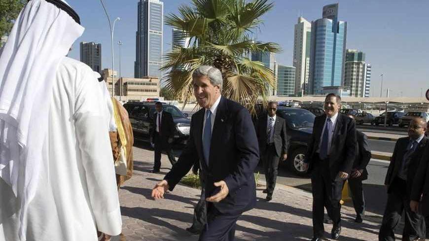 U.S. Secretary of State John Kerry (C) arrives at the Dar Al Athar Islamic Cultural Center in Kuwait City June 26, 2013. REUTERS/Jacquelyn Martin/Pool (KUWAIT - Tags: POLITICS) - RTX111TX