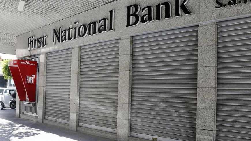 A closed First National Bank branch is seen in Beirut September 4, 2013. Banks and private business corporations saw a one-day strike being held in many parts of Lebanon on Wednesday, organised by economic committees aiming to pressure Lebanese political parties to form a cabinet to maintain the country's economy, local media reported.  REUTERS/Mohamed Azakir (LEBANON - Tags: BUSINESS CIVIL UNREST POLITICS) - RTX136O5