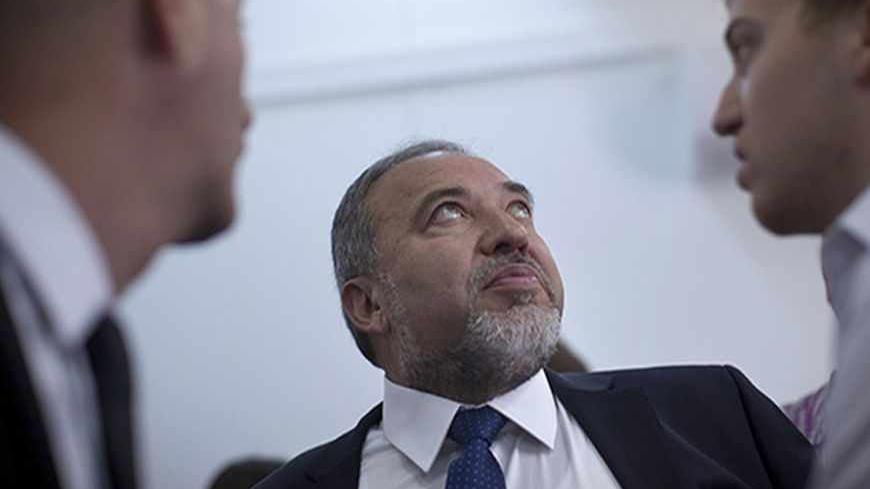 Former Israeli foreign minister Avigdor Lieberman is seen in Jerusalem's magistrate court at the continuation of his trial April 25, 2013. Lieberman was indicted on charges relating to the promotion of an Israeli diplomat who had illegally given him information about a police investigation against him. The allegations led Lieberman, a key ally of Prime Minister Benjamin Netanyahu, to resign from cabinet last December. REUTERS/Uriel Sinai/Pool (JERUSALEM - Tags: POLITICS CRIME LAW) - RTXYZC4